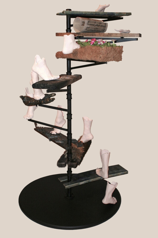 "May Way". 2011. Ceramic, wood, bronze, steel, print, glass, repurposed fur, and flowers in flowerbed. 6 x 3 1/2 x 3 1/2 ft. (182.9 x 106.7 x 106.7 cm).